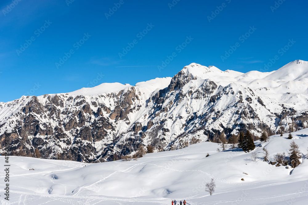 Mountain range of Monte Carega in winter with snow, called the small Dolomites and the Altopiano della Lessinia (Lessinia High Plateau). Veneto and Trentino Alto Adige, Italy, Europe.