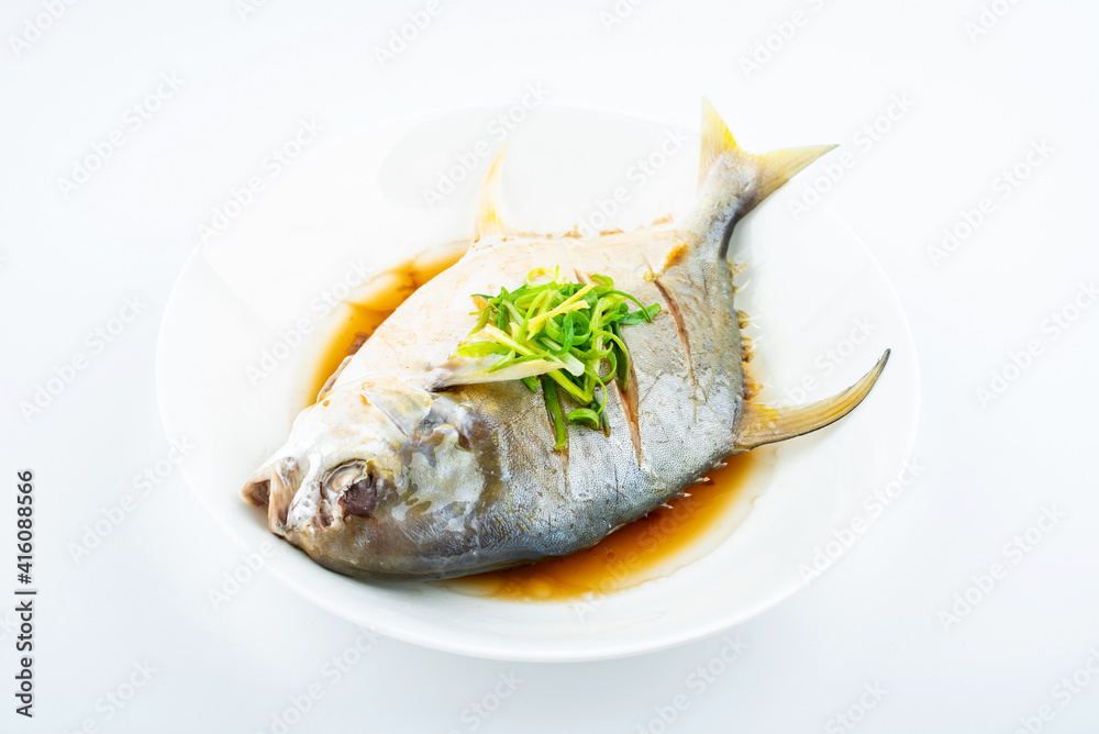 A dish of steamed jinchang fish on white background A dish of steamed jinchang fish on white background