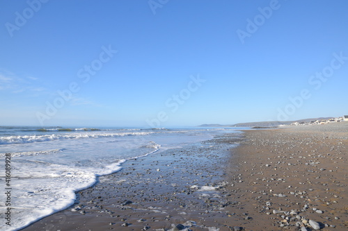 large waves hitting borth beach photo