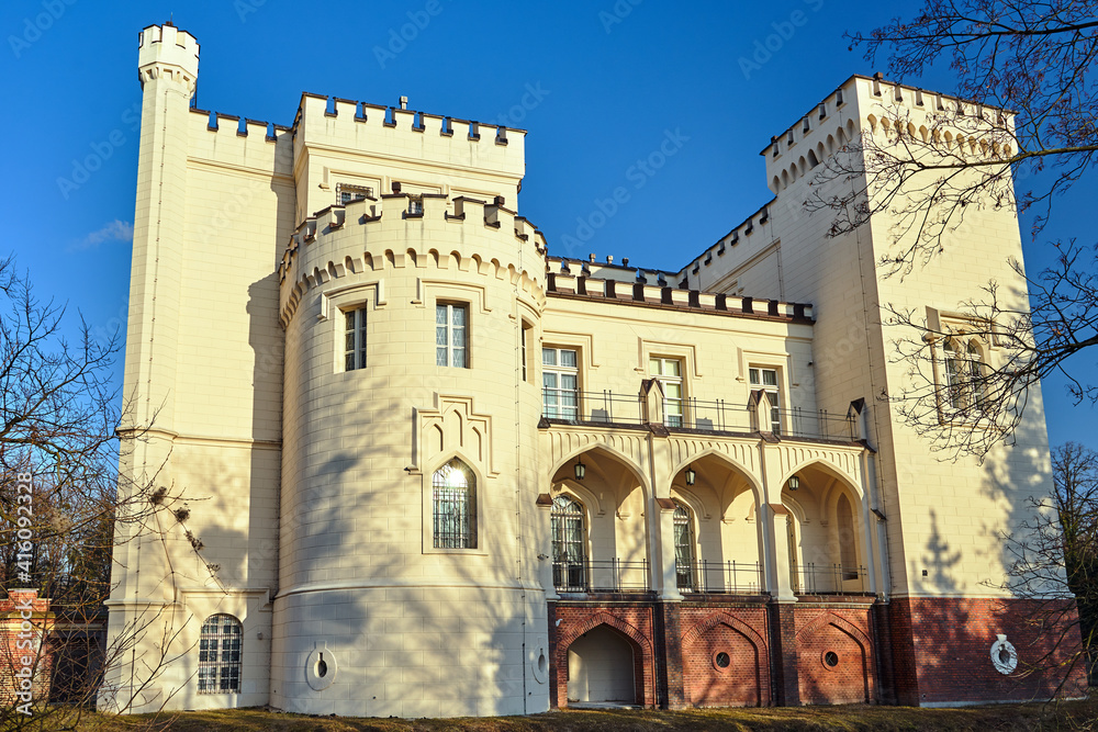 facade of a neo-gothic historic castle in the city of Korni