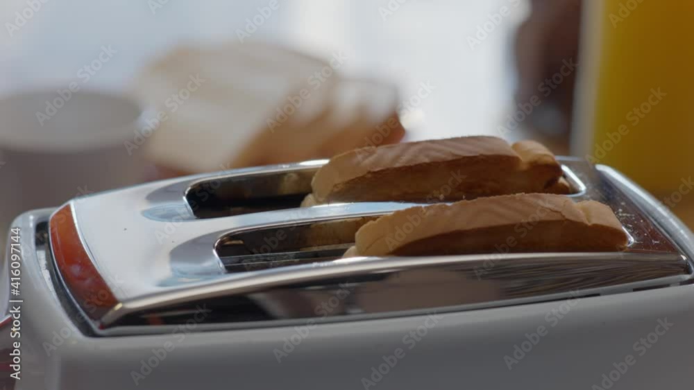 Burning Toast Pops Up In Toaster. Roasted toast bread popping up from