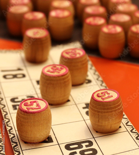 Lotto board game. Wooden lotto barrels and cards. Bingo game. Gambling