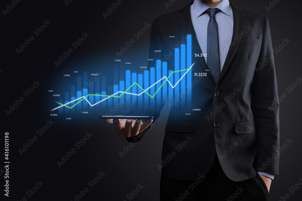 Business man holding holographic graphs and stock market statistics gain profits. Concept of growth planning and business strategy. Display of good economy form digital screen. Business man holding holographic graphs and stock market statistics gain profits. Concept of growth planning and business strategy. Display of good economy form digital screen.