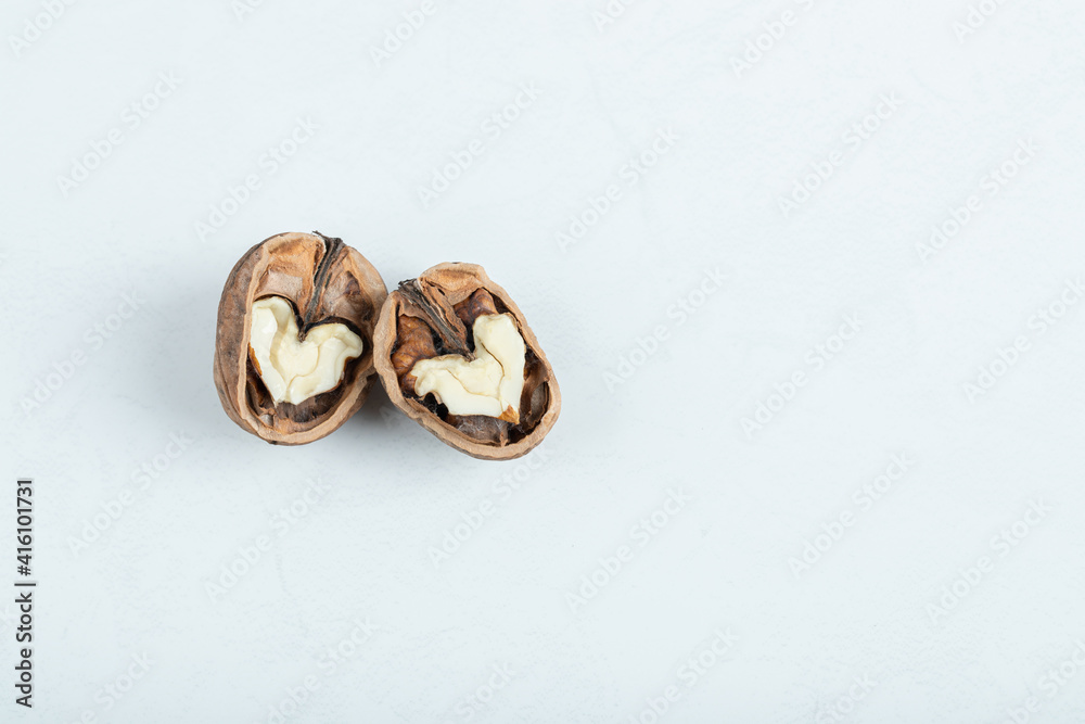 Cracked walnut isolated on the white background Cracked walnut isolated on the white background