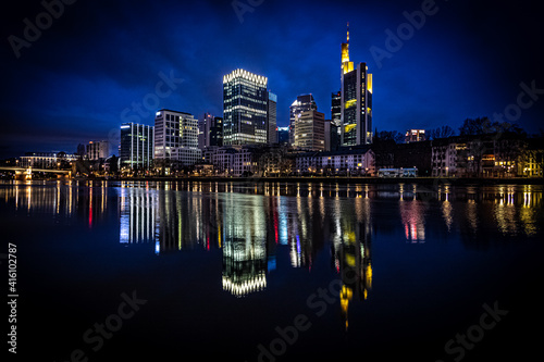 Skyline in Frankfurt. unique light in a great city on the river Main. Reflection in the water. Street photography, puddles, views, gorges and architecture