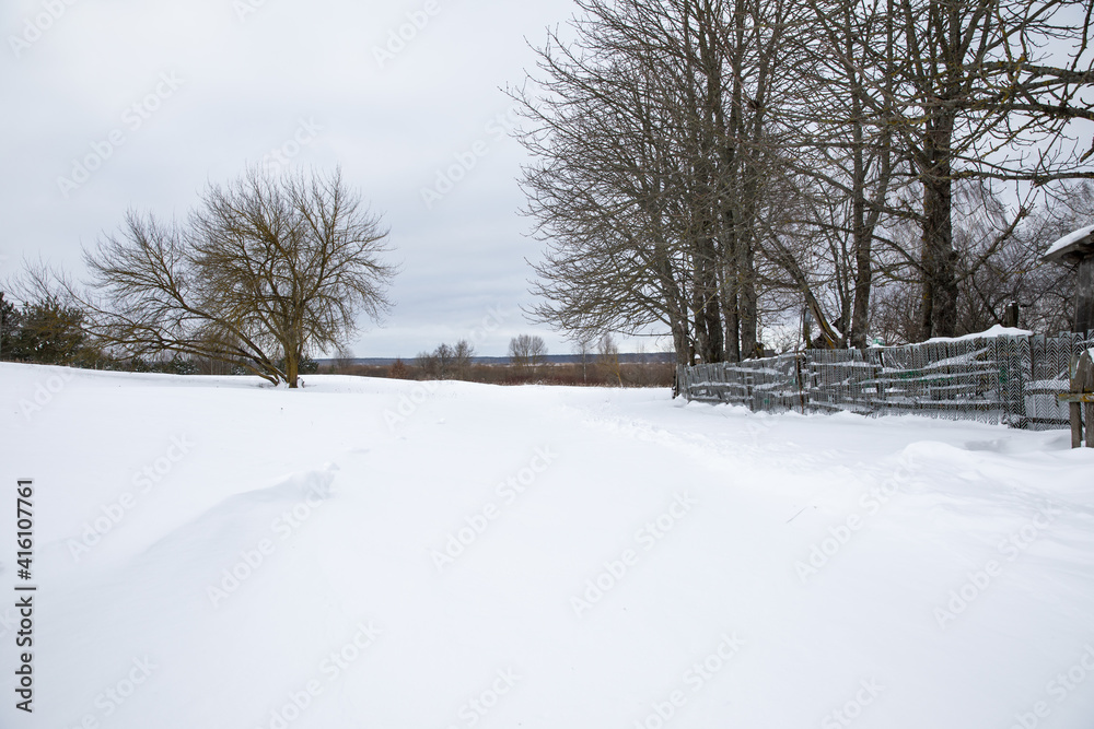 Snow covered the streets roads fences houses in the village. A large snowfall formed large drifts of snow. Snow covered the streets roads fences houses in the village. A large snowfall formed large drifts of snow.