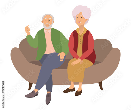 Elderly couple sitting on the sofa at home isolated on white background. Retired elderly couple. Grandparents family, grandmother and grandfather happy friends sitting on the couch communicating