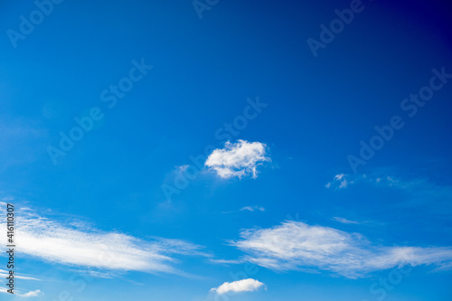 Blue sky with scattered blue clouds