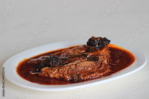 Sardines curry is a traditional central Kerala fish curry. photo