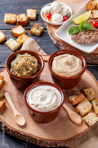 .Meze is an oriental set of appetizers served in small bowls with babaganush, curd, hummus and kibbeh
