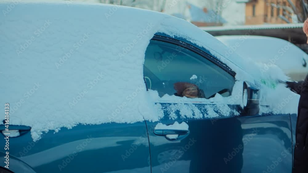 Woman Cleaning Car After Snowfall.Brushing Snow And Ice From Car Glass.Female Cleaning Fresh Snow After Snowstorm From Vehicle.Sweep Snow From Automobile With Brushes In Winter.Scraping Ice From Glass Woman Cleaning Car After Snowfall.Brushing Snow And Ice From Car Glass.Female Cleaning Fresh Snow After Snowstorm From Vehicle.Sweep Snow From Automobile With Brushes In Winter.Scraping Ice From Glass