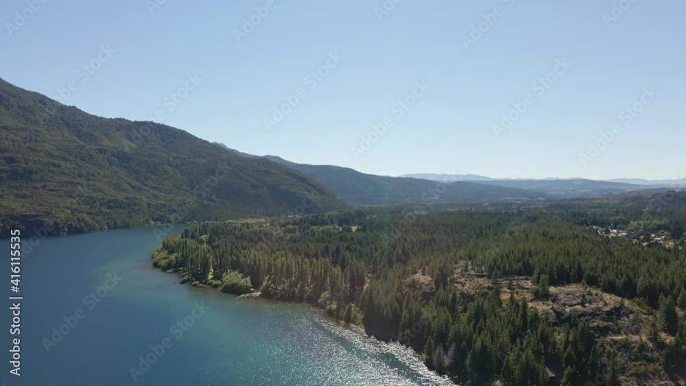 Aerial pan right over Epuyen lake between mountains and pine tree woods, Patagonia Argentina Aerial pan right over Epuyen lake between mountains and pine tree woods, Patagonia Argentina