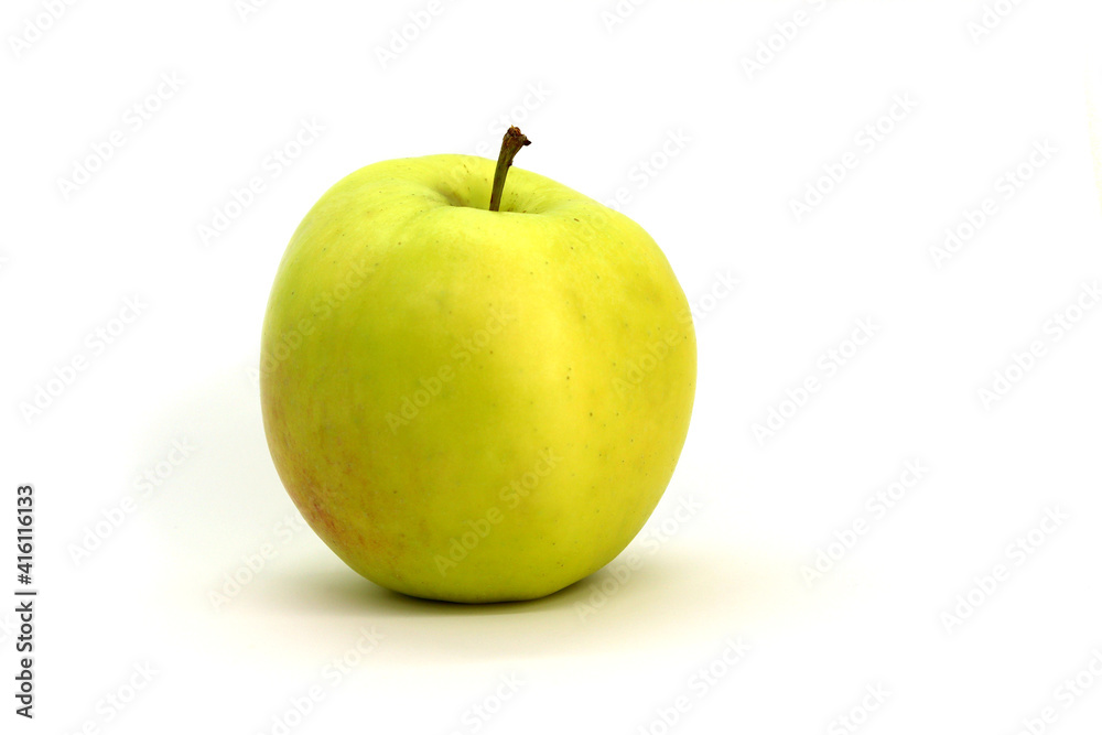 A green apple on a white background is isolated