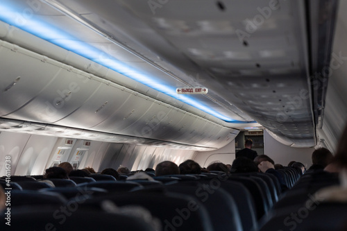 Interior of the plane with exit sign on russian language