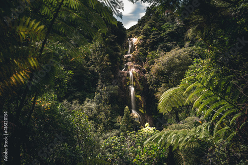 The beautiful Kitekite waterfalls found not far from Auckland, New Zealand in the middle of the jungle photo
