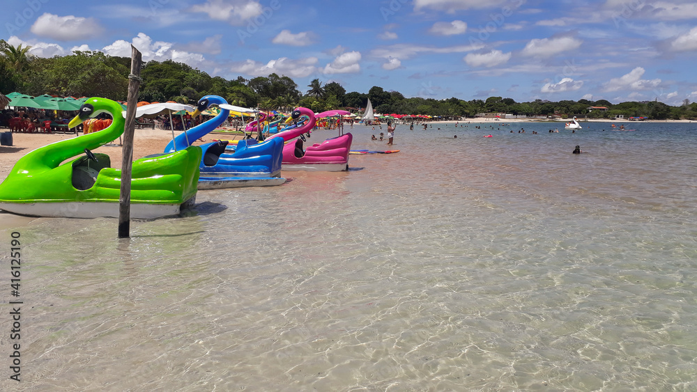 Colorful pedal boats in the crystalline blue lagoon Colorful pedal boats in the crystalline blue lagoon