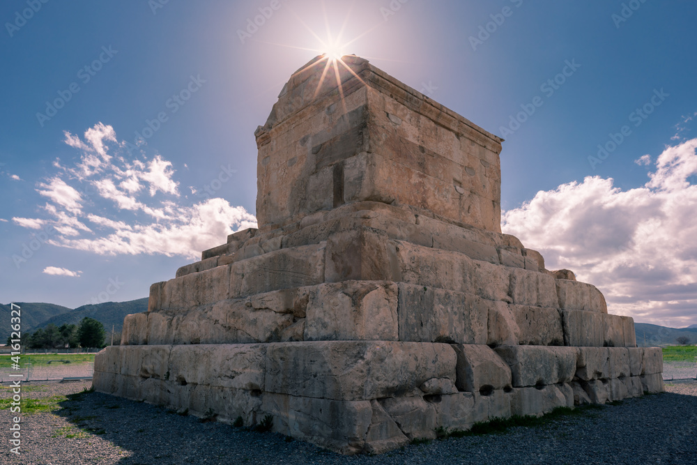 Tomb of Cyrus the Great, Fars Province, Iran, on a hot sunny day. Sunstar at the edge of the tomb. Famous historical site of ancient Persia