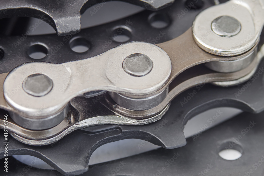 Stars of a bicycle cassette with chain links in a macro photo Stars of a bicycle cassette with chain links in a macro photo