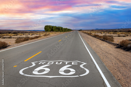 Route 66 shield marker on the highway in the Mojave Desert photo
