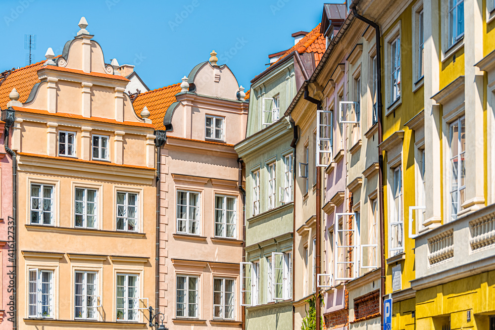 Warsaw, Poland old town Kanonia square with historic street town architecture and multicolored pattern of pink and yellow vintage color buildings