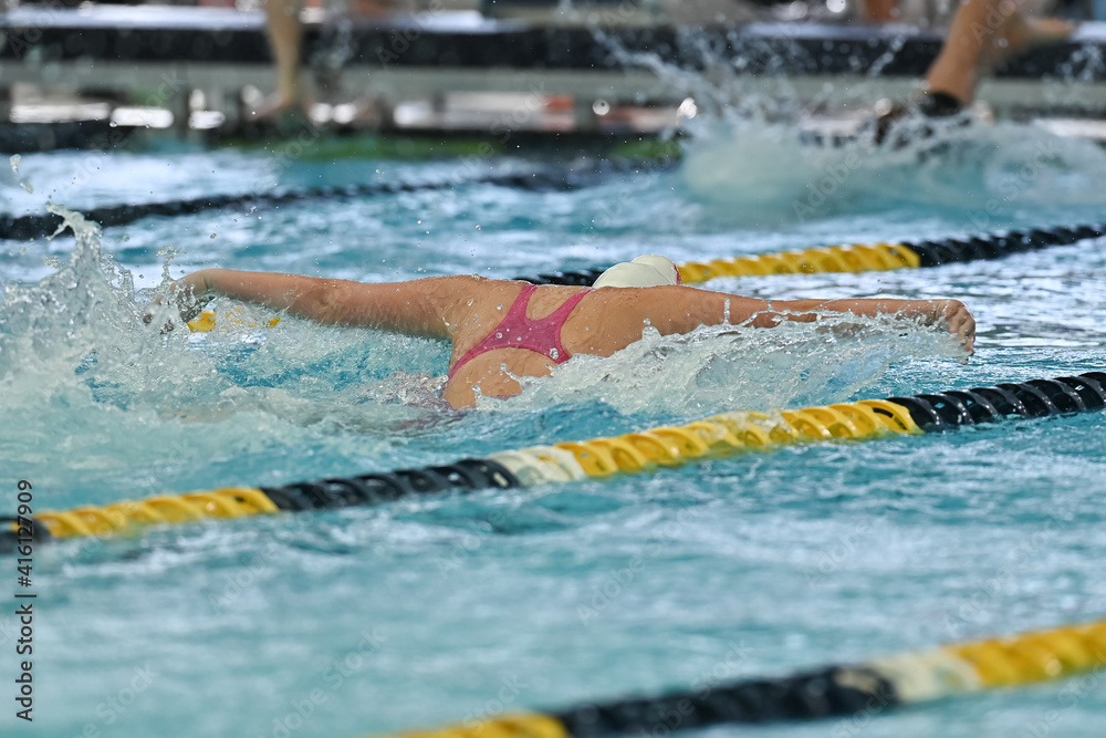 Young girl competing in a swim meet