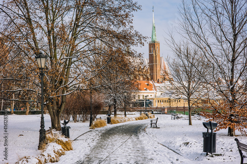 Beautiful winter road in the center of Wroclaw. in the distance church towers on ostrow tumski  © Krzysztof