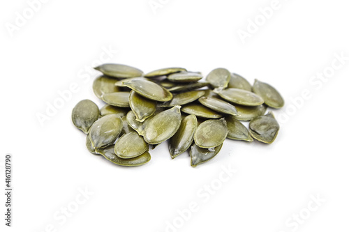 Pumpkin seeds isolated on a white background. Heap of dry pumpkin seeds