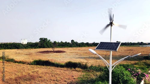 Using solar cells to store solar energy to make the lampwork at night. And the use of wind turbines to store energy