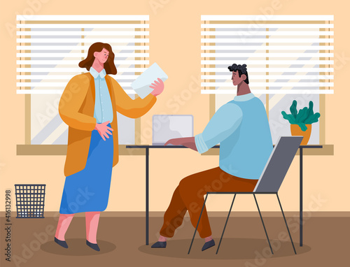 Office workers discussing document. Business people dressed in casual clothes in office interior with laptops talking. Business meeting and consideration of working issues. Friendly team work