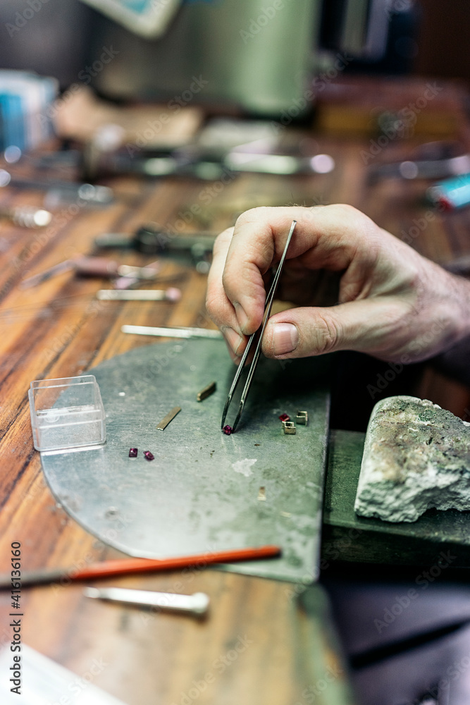 Hand of an artisan Making Handmade Jewelry Hand of an artisan Making Handmade Jewelry