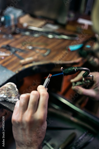 Hands of an artisan Making Handmade Jewelry