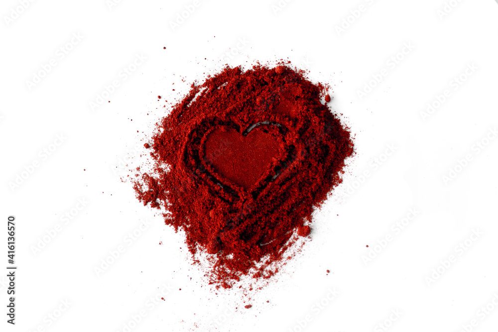 Close-Up Of Ground Red Chili Pepper Over White Background. Pile of ground Paprika isolated in heart Close-Up Of Ground Red Chili Pepper Over White Background. Pile of ground Paprika isolated in heart