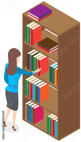 Beautiful brunette librarian woman in library chooses books on shelves in bookcase back view. Young female at book showcase looks at literature in bookstore. Girl student reads and educates herself