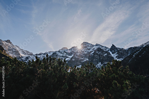 Fototapeta Naklejka Na Ścianę i Meble -  Sunrise from top mountains covered snow