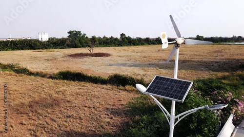 Using solar cells to store solar energy to make the lampwork at night. And the use of wind turbines to store energy