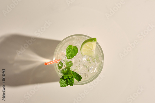 Mojito cocktail on white marble table. Top view with copy space for your text.