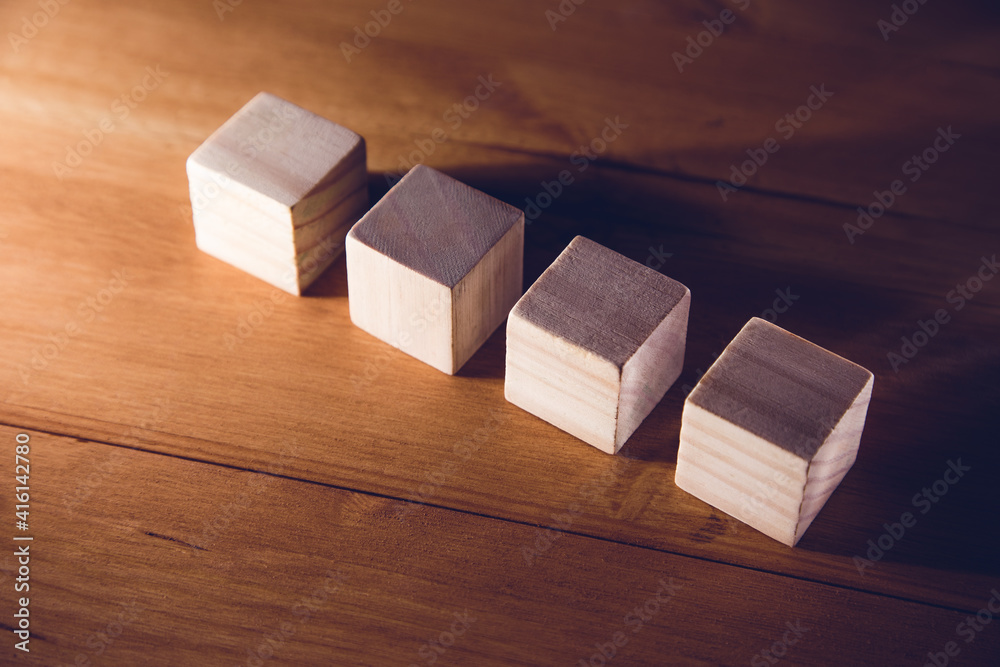 wooden cubes blocks on wooden background