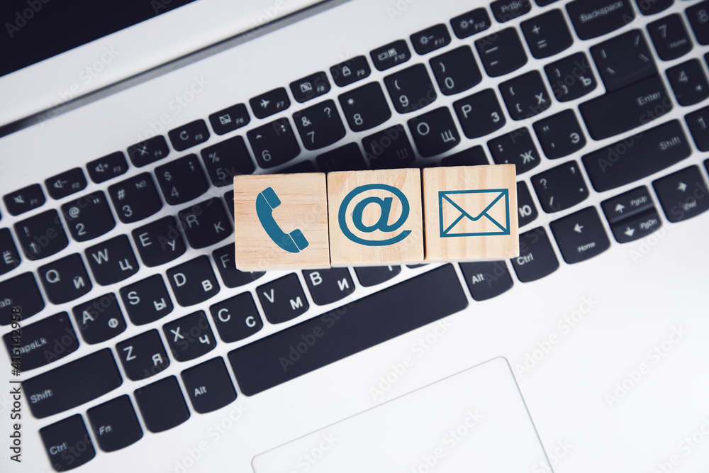 Internet symbol on a wooden cube on a keyboard Internet symbol on a wooden cube on a keyboard