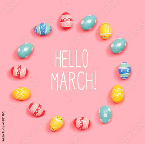 Hello March message with round frame of Easter eggs