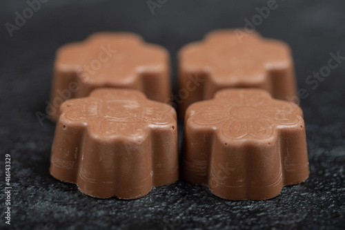Some of chocolate candies on a dark background