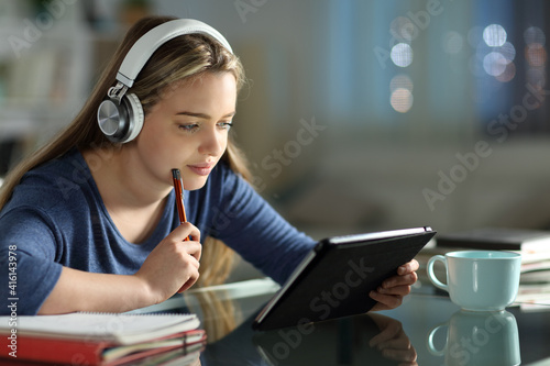 Plakat Student e-learning with tablet and headphones