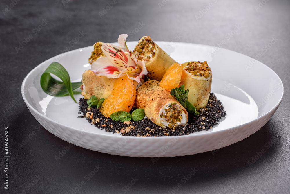 Delicious fresh sweet pancakes on a plate with pistachios and poppy Delicious fresh sweet pancakes on a plate with pistachios and poppy