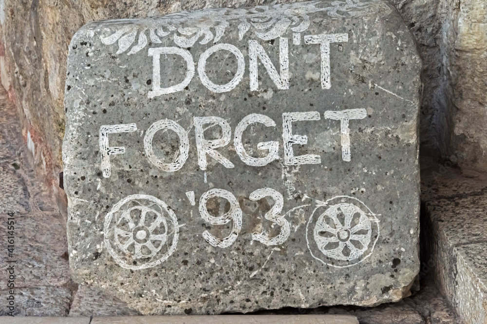 Stone sign, Don't Forget '93, on Stari Most (Old Bridge), a reminder of the war, Mostar, Bosnia and Herzegovina Stone sign, Don't Forget '93, on Stari Most (Old Bridge), a reminder of the war, Mostar, Bosnia and Herzegovina