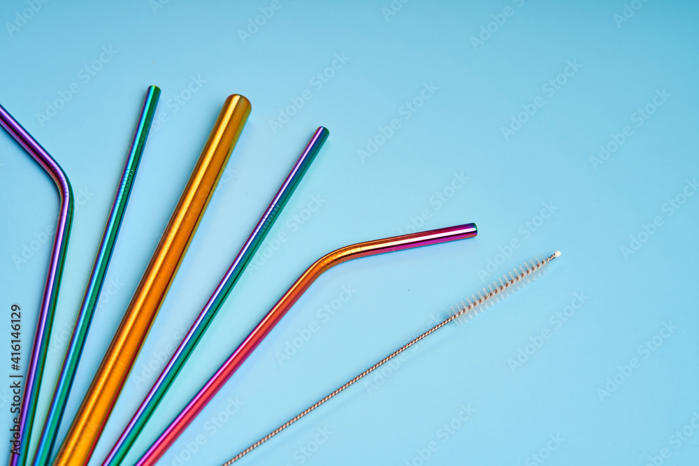 The modern trend in environmental care. Reusable metal straws for drinks. Replacement with common plastic beverage straws The modern trend in environmental care. Reusable metal straws for drinks. Replacement with common plastic beverage straws