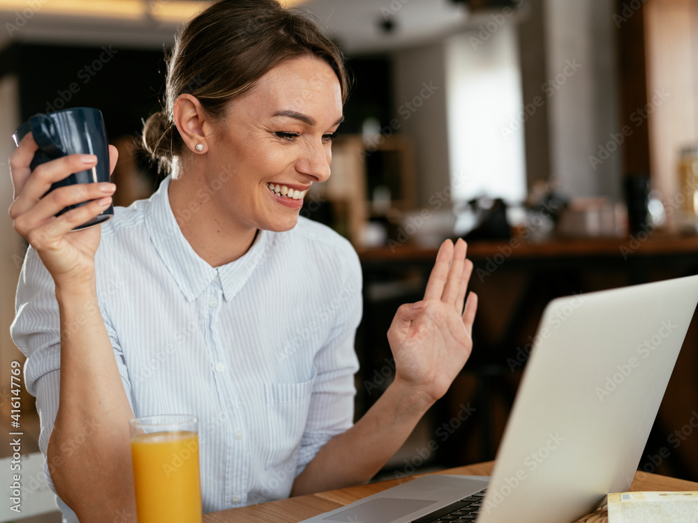 Beautiful woman drinking coffee and having video call. Young girl enjoying in morning coffee. Beautiful woman drinking coffee and having video call. Young girl enjoying in morning coffee.