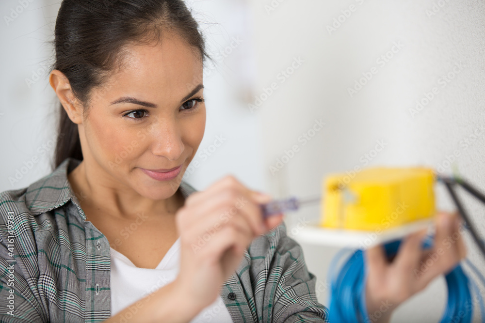 happy female worker smiling at camera happy female worker smiling at camera