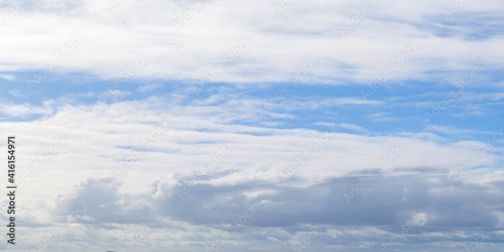 Blue sky with white clouds on a daytime, natural panorama