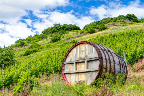 Großes Weinfass aus Holz inmitten eines Weinberges in der Nähe der Ortschaft Mesenich, Rheinland-Pfalz photo