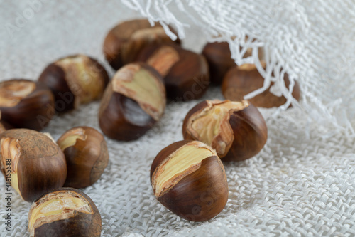 Delicious healthy chestnuts on a white sackcloth