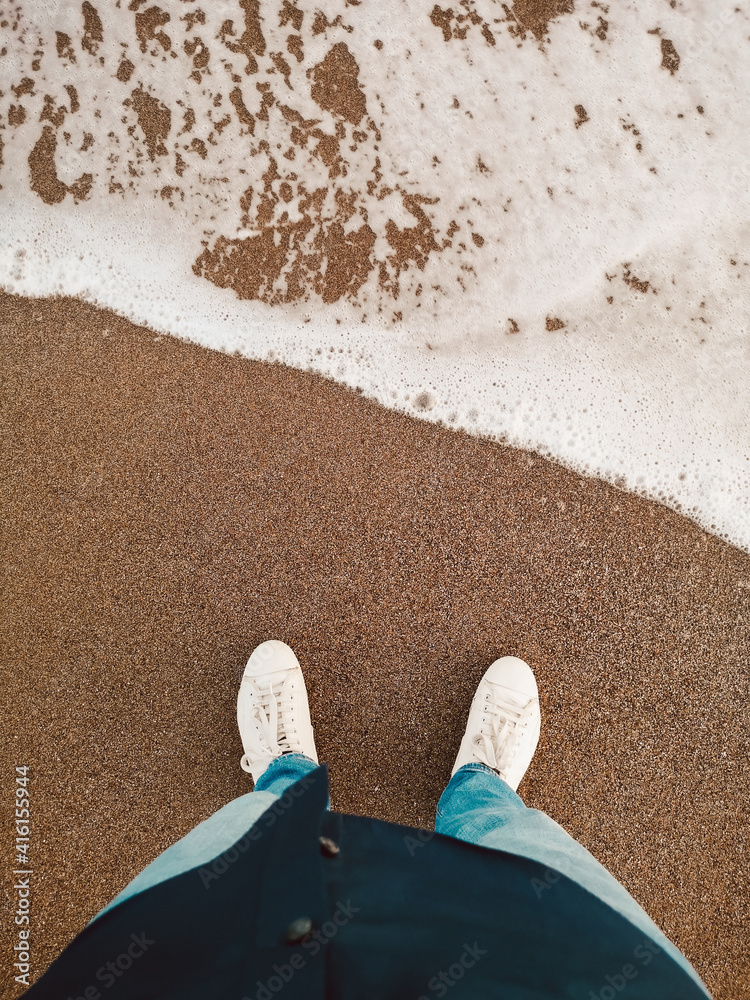 Fototapeta premium Standing by the sea shore